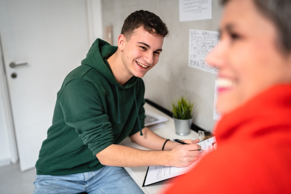 smiling young man in residential program for addiction recovery