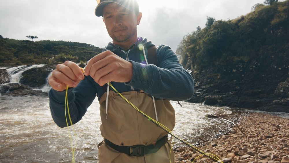 young man preparing to go fishing, a recreational activity in Utah substance abuse program